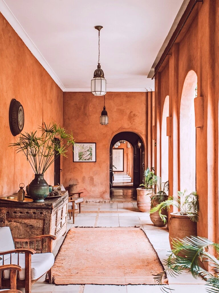 Hallway interior design in Moroccan style featuring an orange and white theme