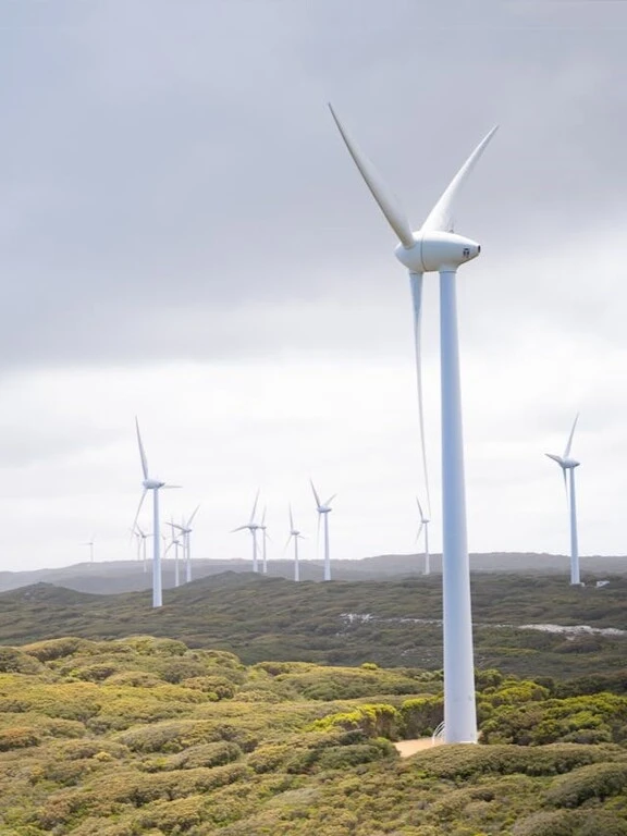 Wind energy generated by wind turbines on a hillside
